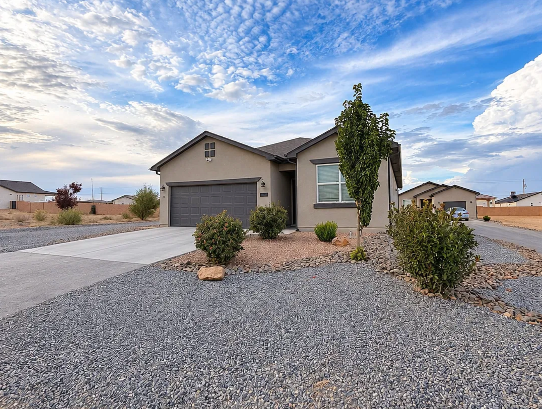 Dignity HomeShare home at 333 9th Ave NE, Rio Rancho, NM — a modern single-story stucco home with desert landscaping